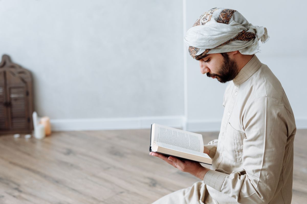 A Muslim man reading the Quran
